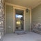 Home with a porch and reflective glass front door