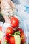 Home preserving of tomatoes. the hand settles the tomatoes in a jar for canning for the winter.