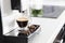 Home professional coffee machine with espresso cup.