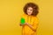 Home purchase, rental apartment. Portrait of happy joyful curly-haired young woman showing paper house