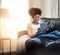 Home, relax and black woman with tablet, smile and connection with lens flare, social media and digital app. African