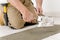 Home renovation - handyman laying tile
