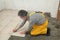 Home renovation, worker placing tile