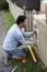 Home renovator installing a new mailbox