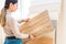 Home repair. portrait of woman choosing wood laminated flooring in shop