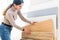 Home repair. portrait of woman choosing wood laminated flooring in shop