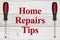 Home Repairs Tips message with screwdrivers on weathered wood