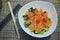 Home salad with slices of smoked salmon