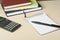 Home savings, budget concept. Chart, notepad, pen, calculator and coins on wooden office desk table.