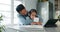 Home school, dad and child hug in kitchen with card, tablet and headphones for learning, education and reading