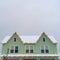 Home with snowy roof and Christmas lights in Utah