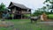 home stay farm between green paddy field in thailand, beautiful farm with green rice field