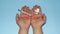 Home stay, in red letters on a man`s hands,antibiotic and thermometer in hands isolated on a blue background