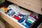 Home storage system for colorful children clothes. Organizer for underwear. Organizational space - management of environment.
