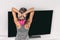 Home strength training workout overhead triceps extension muscles exercises woman watching online tv class live