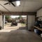 Home suburban countryside modern car and ATV double garage interior with wooden shelf, tools and equipment stuff storage warehouse