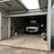 Home suburban countryside modern car and ATV double garage interior with wooden shelf, tools and equipment stuff storage warehouse