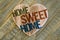 Home Sweet Home message wooden heart on light green painted back