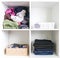 Home wardrobe with different clothes. Small space organization. The contrast of order and disorder