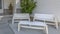 Home with white wooden furniture on front patio
