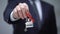 Home word on keychain in businessman hand, house purchase, rental services