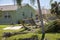 Home yard with scattered debris after hurricane Ian in Florida. Consequences of natural disaster