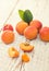 Homegrown apricots on vintage white wooden table