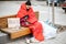 Homeless beggar on the bench near the business center