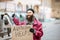 Homeless beggar with cardboard outdoors