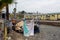 A homeless camp stands adjacent to trash and debris near 8100 Haskell Ave