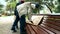 A homeless couple, a man and woman on a bench in a city Park