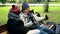 A homeless couple, a man and woman on a bench in a city Park