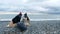 Homeless couple, man and woman, staying overnight by the sea