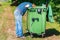 Homeless looking for food in waste container