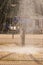 Homeless man bathing in a Public fountain in Palanga, Lithuania