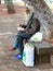 Homeless man eating.