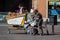 Homeless man sitting on on the market square in Barceloneta during the Covid alert state