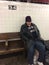 Homeless man in subway on 34th street in NYC