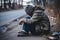 A homeless person covers his face and wears a torn hat. Ragged, dirty, sitting on the side of the road in the capital