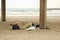 Homeless person sleeping on beach