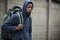 Homeless Teenage Boy On Streets With Rucksack