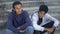 Homeless young men feeling sad sitting stairs, emotional physical abuse violence