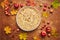 Homemade apple cake with with sour cream, red apples, Crabapples and cinnamon over wooden background, top view