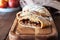 Homemade apple hand pies on a wooden board. Close up