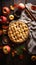 A Homemade apple pies on rustic background and apples, classic dessert for Thanksgiving, top view,