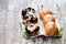 Homemade assorted profiteroles on wooden table