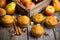 Homemade atutumn muffins with pumpkin, apples and spices on the rustic background