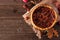 Homemade autumn pecan pie, top view corner border over a rustic wood background