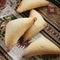 Homemade Azerbaijani Pies, Shekerbura or Triangular Patties on Traditional Rustic Tablecloth