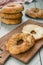 Homemade bagel with butter on a wooden board